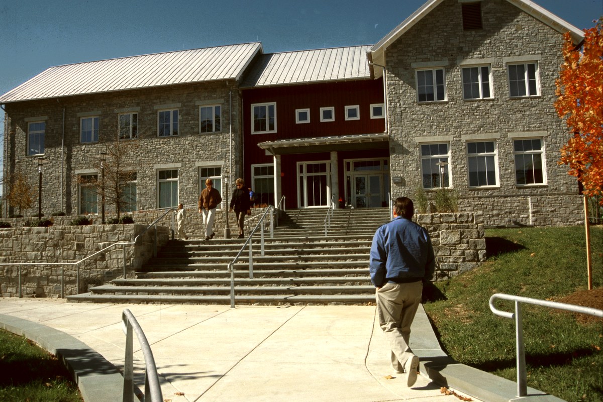 Students walking across a college campus