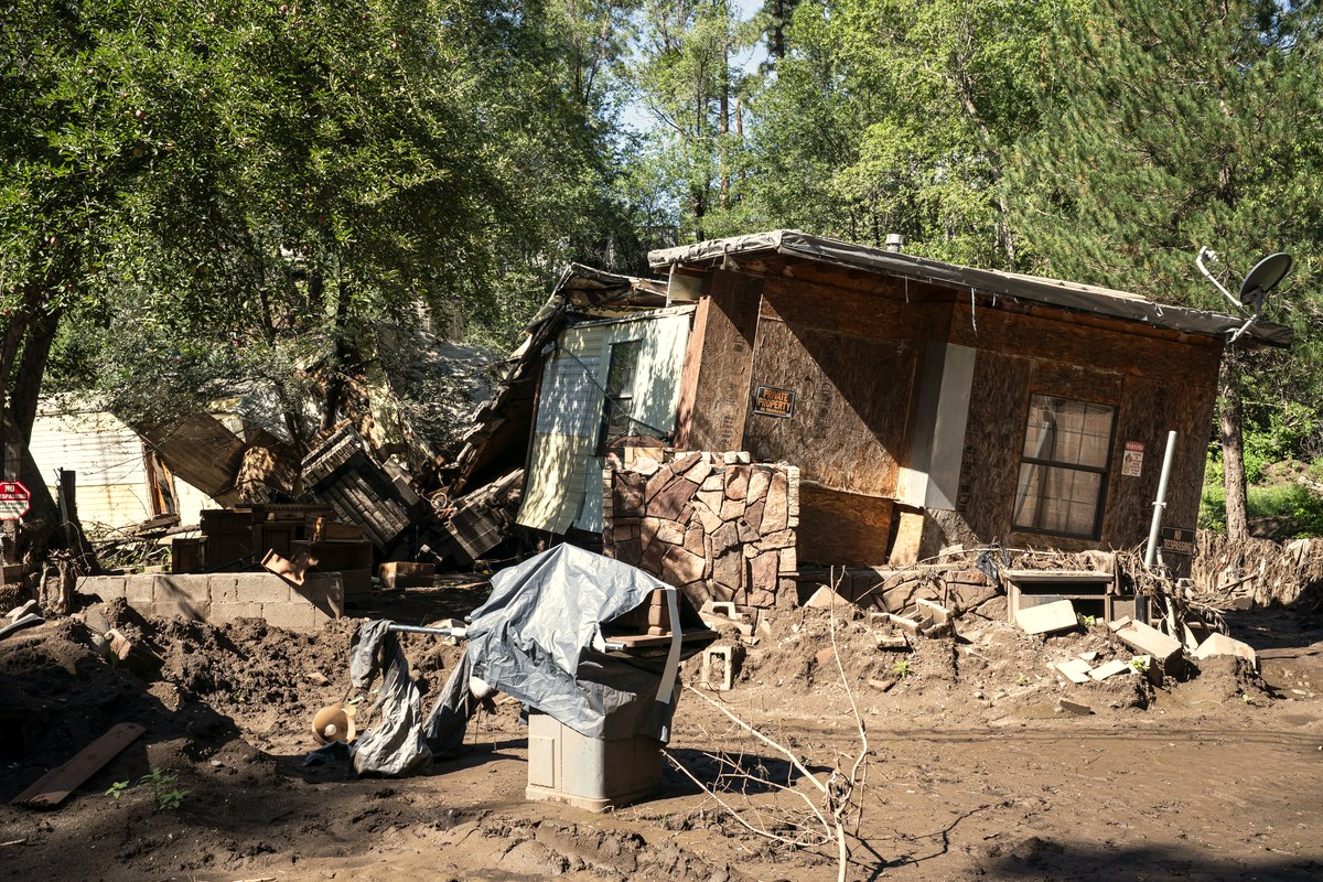 A home destroyed by flooding in Ruidoso, New Mexico, photographed in August 2025