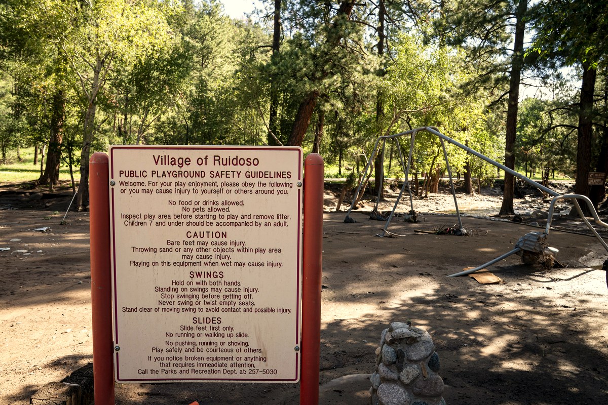 Officials touring flood-damaged areas in Ruidoso, New Mexico, in August 2025
