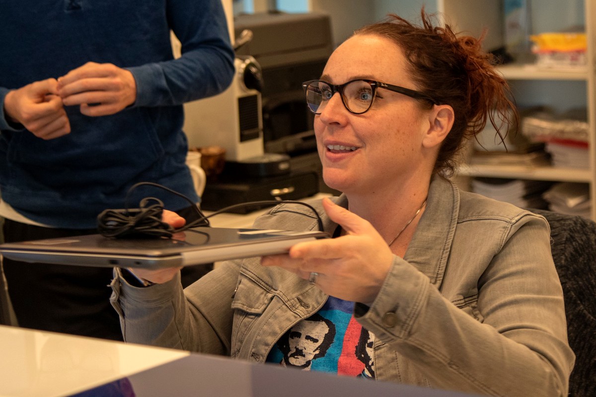 Students and parents picking up laptops for online classes